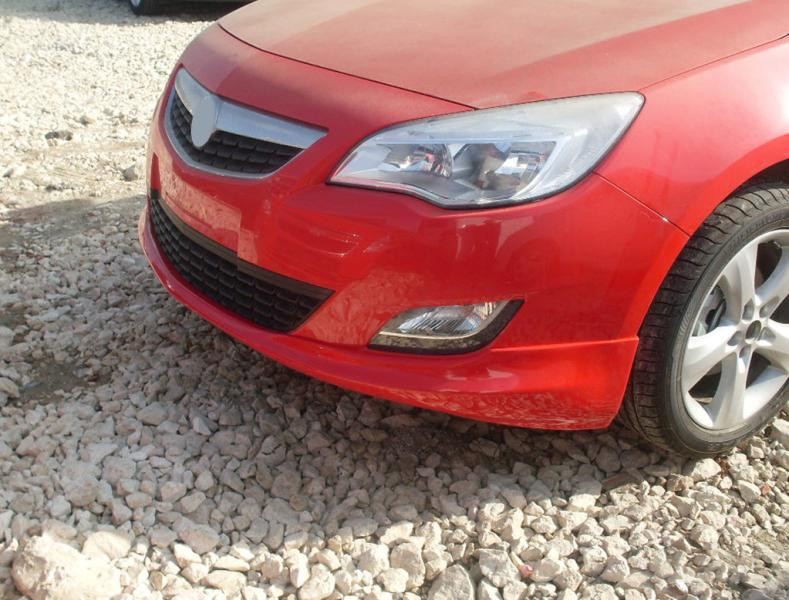 Купити Передня нижня накладка 2010-2012 (під фарбування) для Opel Astra J рр
