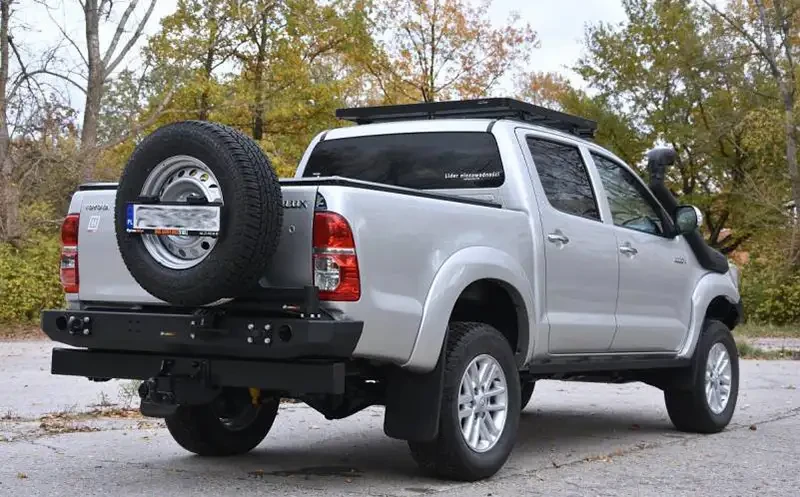 Купити Задній бампер під тримачі колеса та каністри Toyota Hilux 04-15 F4X4