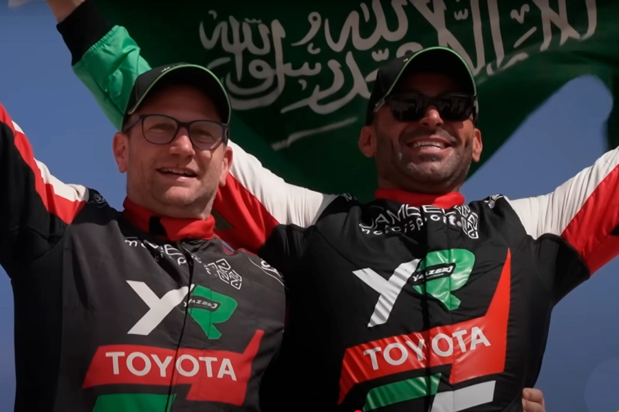 Saudi driver Yazeed Al-Rajhi and his team celebrate a historic victory in the Toyota Hilux GR DKR Evo.