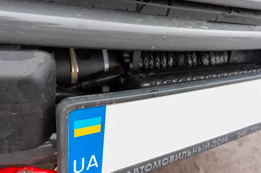 Кріплення для рамки номерного знака